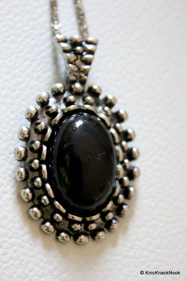 Black and Silver Tone Pendant